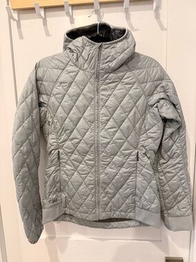 Outdoor Research Women's Quilted Hooded Puffer Jacket in Light Gray